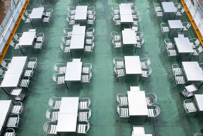 High angle view of tables and chairs in restaurant