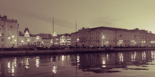 Reflection of buildings in city at night