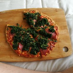 Close-up of pizza on cutting board