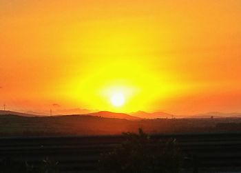 Scenic view of dramatic sky during sunset