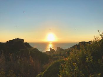 Scenic view of sea against sky during sunset