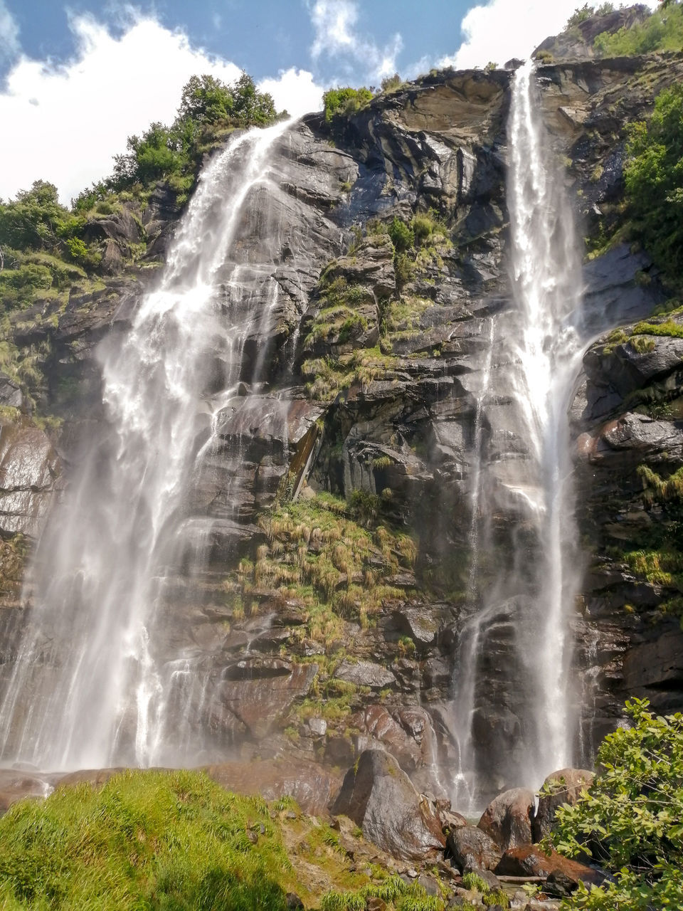 SCENIC VIEW OF WATERFALL IN FOREST