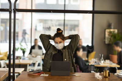 Woman in cafe using digital tablet