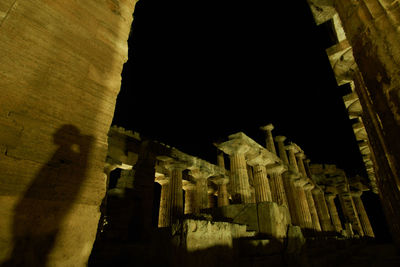 Low angle view of historical building at night
