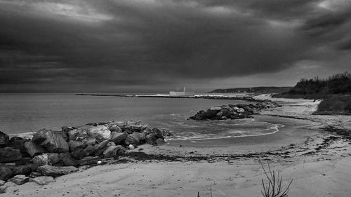 Scenic view of sea against cloudy sky