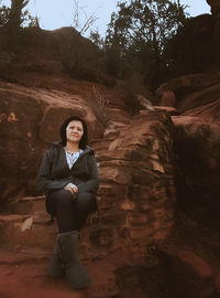 Portrait of man standing on rock