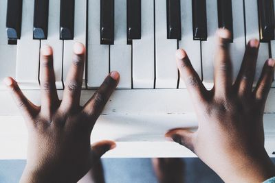 Directly above shot of man playing piano