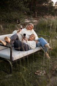 Female friends sitting on bench