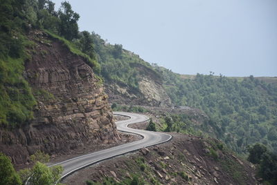 Scenic view of mountain road against sky