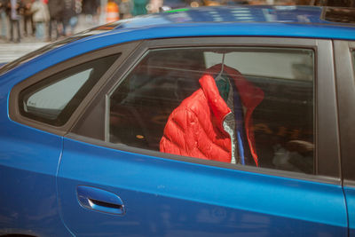 View through window of jacket hanging in car