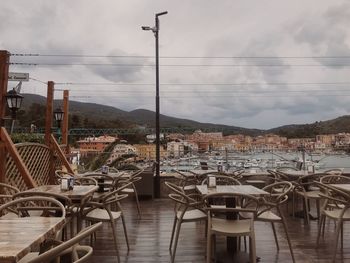 View of restaurant by buildings against sky