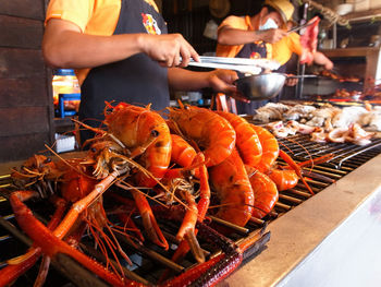 Midsection of man working at restaurant