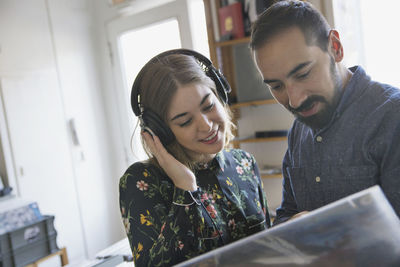 Young couple shopping for records together