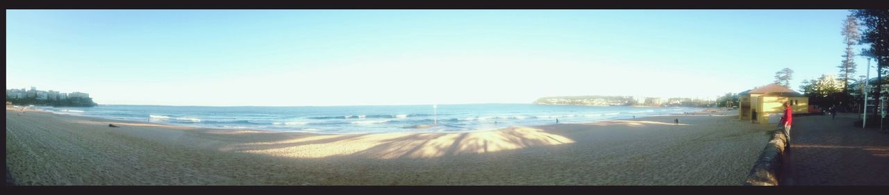 beach, sea, clear sky, sand, water, transfer print, shore, copy space, horizon over water, auto post production filter, tranquil scene, tranquility, panoramic, scenics, nature, beauty in nature, coastline, incidental people, blue, sunlight