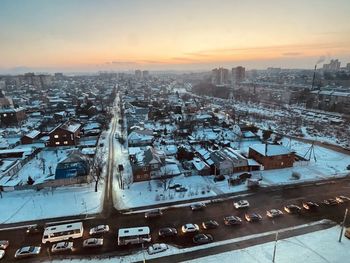 High angle view of cityscape against sky during sunset