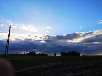 Scenic view of field against sky during sunset