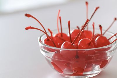Close-up of red fruit in glass bowl