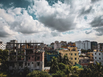 Buildings in city against sky