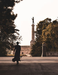 Full length of man statue against clear sky