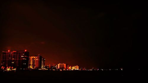 Illuminated cityscape at night