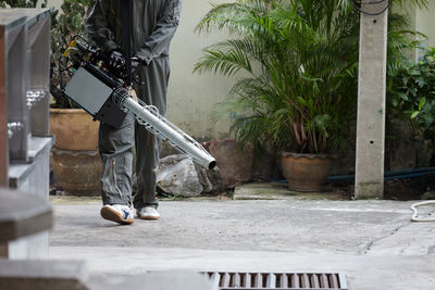 A worker use fumigation mosquitoes machine for kill mosquito