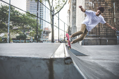 Man skateboarding on skateboard in city