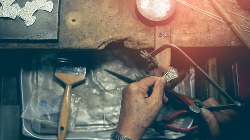 Midsection of man working in machine