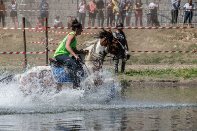 Man riding horse in water