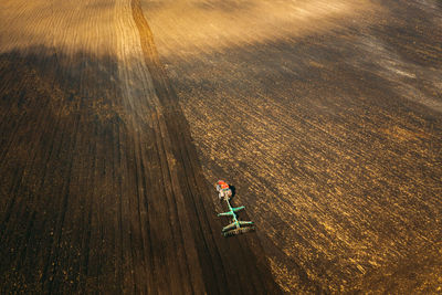 High angle view of people riding bicycle on road