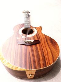 Close-up of guitar against white background