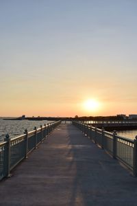 Scenic view of sea against clear sky during sunset