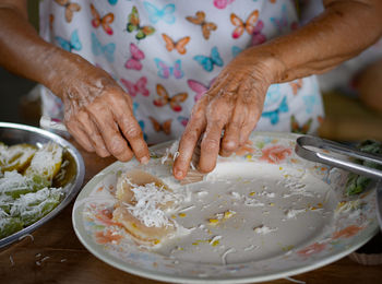 Midsection of woman preparing food