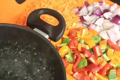 High angle view of chopped vegetables in cooking pan