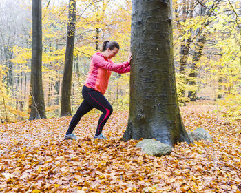 Woman stretching in park  on the move