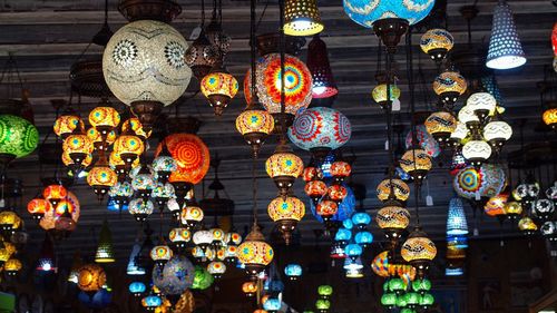 Low angle view of illuminated lanterns hanging on ceiling