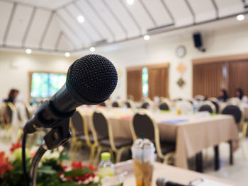 Close-up of microphone in auditorium