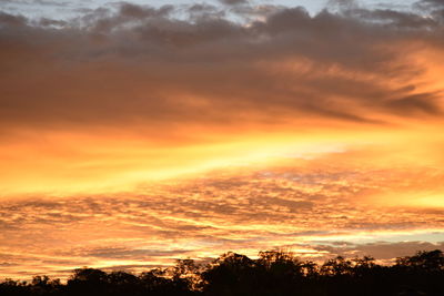 Low angle view of cloudy sky at sunset