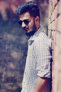 Portrait of young man wearing sunglasses