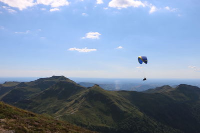 Aerial view of sea with mountain range in background