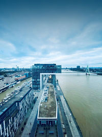 High angle view of bridge over river amidst buildings in city