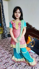 Portrait of smiling girl in traditional clothing