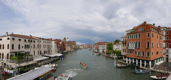 High angle view of canal amidst buildings in city