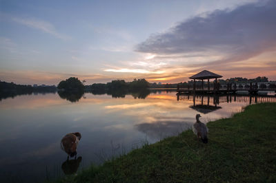 Scenic view of lake against sky during sunset