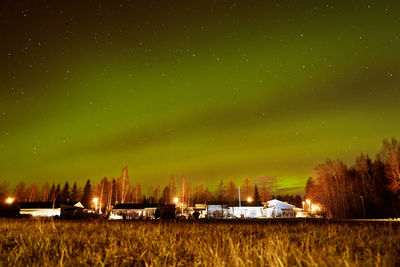 Scenic view of field against sky at night