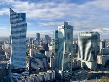 Modern buildings in city against sky