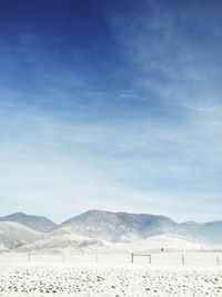 Scenic view of mountains against sky during winter