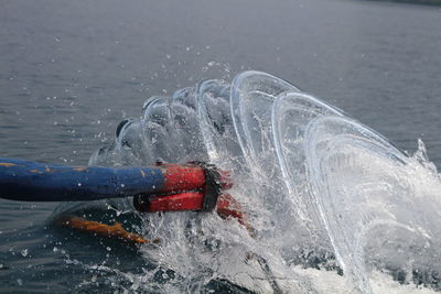 Man splashing water in sea