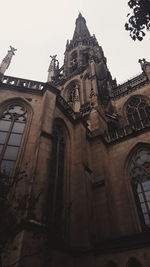 Low angle view of bell tower against sky