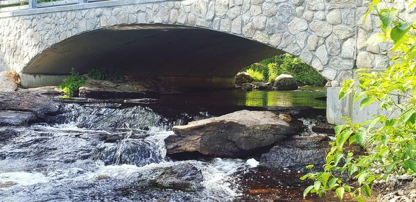 Arch bridge over river