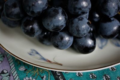High angle view of fruits in plate on table